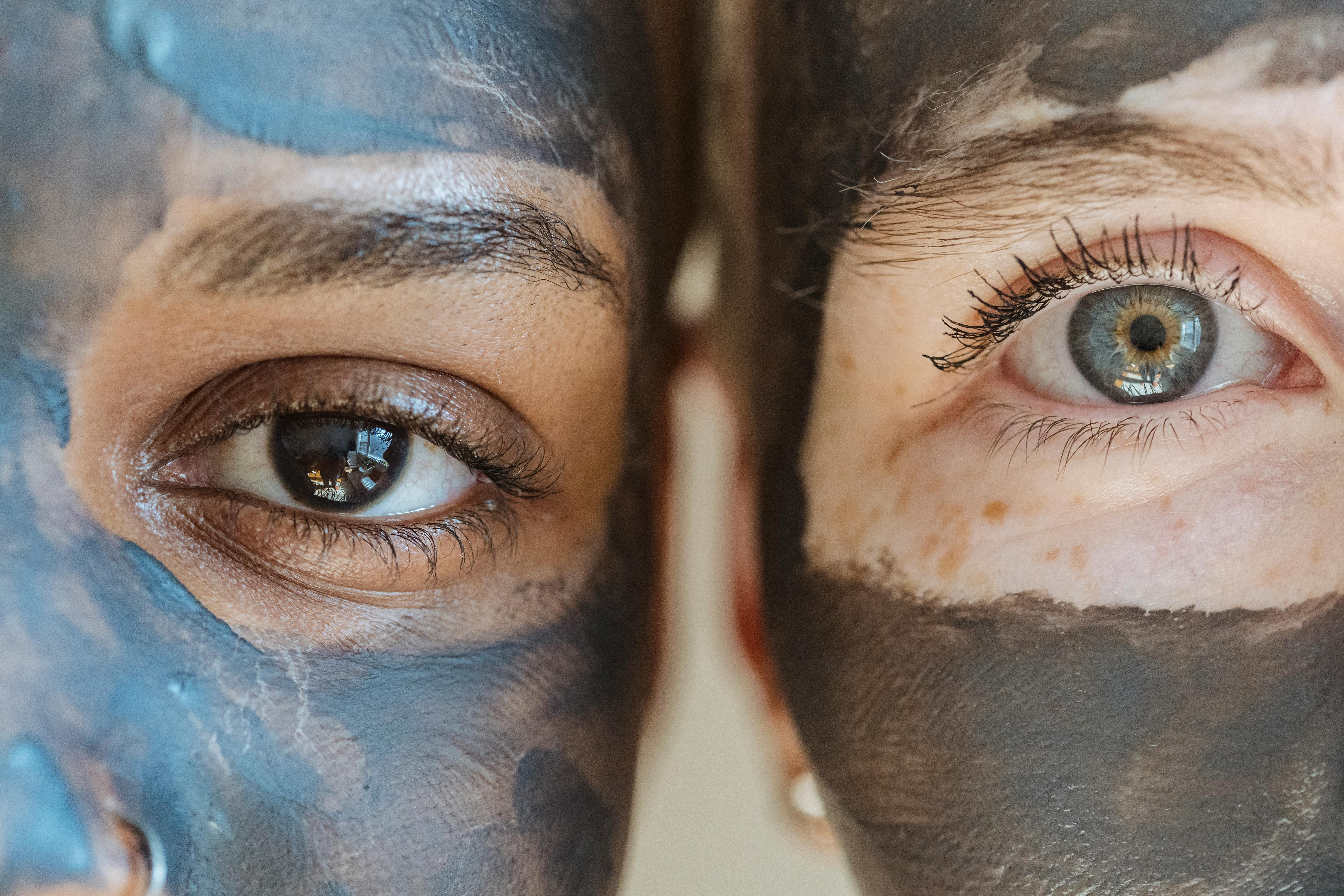 a woman applying a face mask